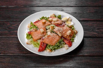 Delicious fresh salad with red fish for the festive table