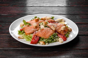 Delicious fresh salad with red fish for the festive table