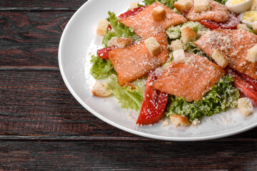 Delicious fresh salad with red fish for the festive table