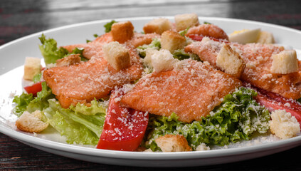 Delicious fresh salad with red fish for the festive table