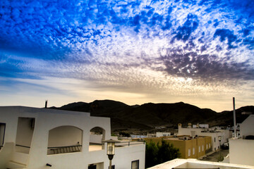 Sky with altocumulus floccus clouds at sunset in Almeria, Spain