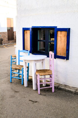 Fototapeta na wymiar Empty bar terrace in Las Negras village with funny furniture