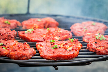 Spicy grilled pork neck with herbs. Grilled steak in summer.