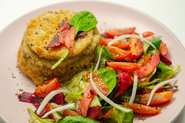 Smoked haddock fishcake with melting cheddar sauce and mixed salad