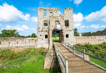 The stone and flint remains of a medieval disused and derelict castle in rural England. A well...