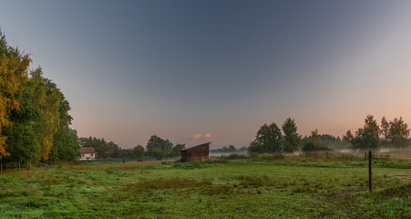 Fototapeta na wymiar Pasture land with morning fog with sunrise light in south Bohemia