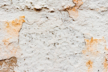 Texture of a concrete wall with cracks and scratches which can be used as a background