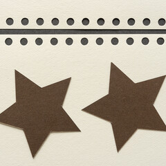 two bronze stars on paper