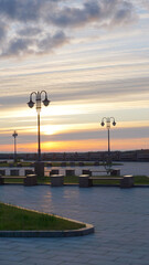 landscape sunset river orange light clouds summer autumn embankment lanterns benches