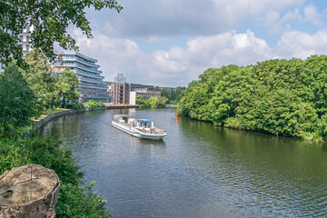 Fototapeta na wymiar Bank of the river Spree Schleswiger Ufer in Berlin, Germany