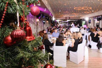 Close up of decorated christmas tree in the restaurant. New Year's corporate event of a large...