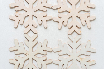 wooden snowflake on a light background