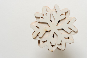 wooden snowflakes isolated on a light background