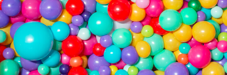 Fototapeta na wymiar Many colorful helium balloons background for holiday