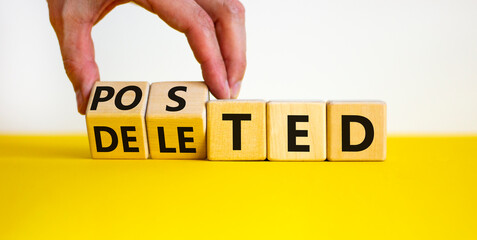 Posted or deleted symbol. Businessman turns wooden cubes and changes the word 'deleted' to 'posted'. Beautiful white background. Business and posted or deleted concept. Copy space.