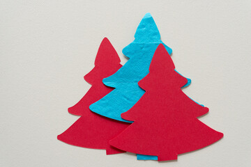 blue and red paper trees on a paper background