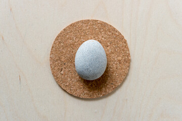 stone on cork and wood background