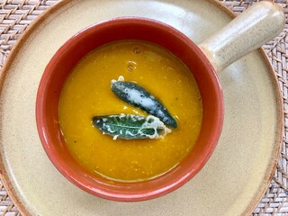 Vegan squash cream on a clay plate