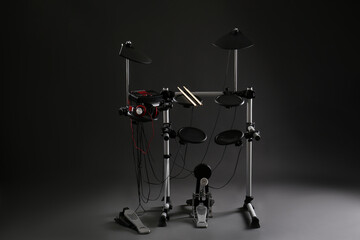 Obraz na płótnie Canvas Modern electronic drum kit on dark background. Musical instrument