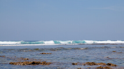 Sea wave at high tide. Tide. Bali Sea, Indonesia. A big wave is moving towards the shore.