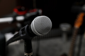 Modern microphone at recording studio, closeup with space for text. Music band practice