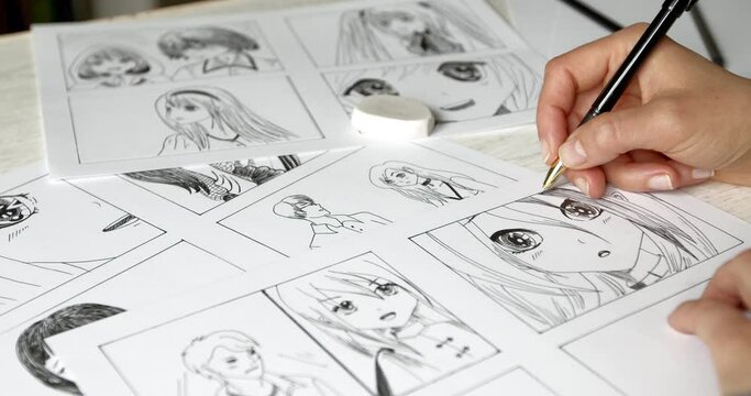 The artist draws anime comics on paper. Storyboard for the cartoon. The illustrator creates sketches for the book. Manga style.