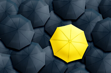 Yellow umbrella standing out of other ones, top view