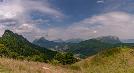 View of Bauges Massif with the tooth of Arclusaz and the tooth of Rossanaz from the Buffaz pass in the french Alps