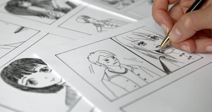 The artist draws anime comics on paper. Storyboard for the cartoon. The illustrator creates sketches for the book. Manga style.