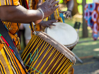 African man's hands playing the African drum. Musical culture. - obrazy, fototapety, plakaty