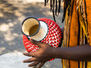 African Man playing traditional percussion