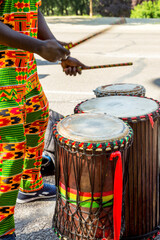 Senegalese man, playing African drums.