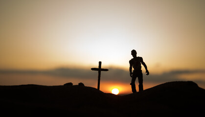 Fototapeta premium Silhouette some zombies on the cemetery walking around at sunset. Selective focus