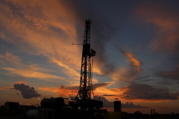 Oil and gas drilling rig at sunset in the Permian Basin of West Texas