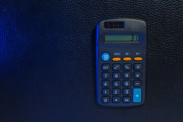 Classic typical black calculator. Economy and accounting symbol. Mathematics and accurate...