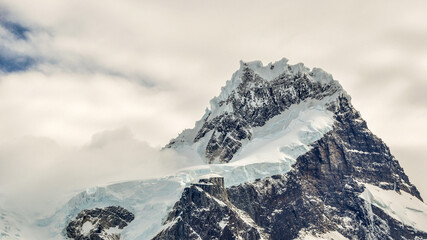 snowcapped peak of Cerro Paine Grande with clouds