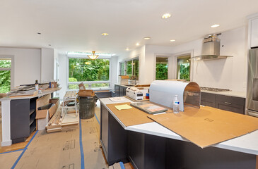 Kitchen remodel with tools and supplies cleaned up. Appliances and countertops in place; custom...