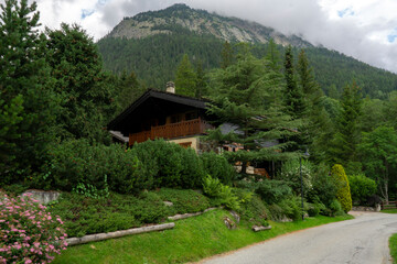 European Alps in the distance. Road among the nature