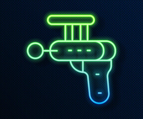 Glowing neon line Ray gun icon isolated on blue background. Laser weapon. Space blaster. Vector