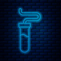 Glowing neon line Test tube and flask chemical laboratory test icon isolated on brick wall background. Laboratory glassware sign. Vector