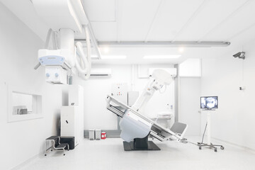Fototapeta na wymiar Modern x-ray machine and Computerized Axial Tomography scanning and diagnostic medical equipment in the operating room data center