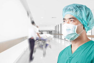 Fototapeta na wymiar Surgeon in medical clothes and medical active staff emergency status in hospital