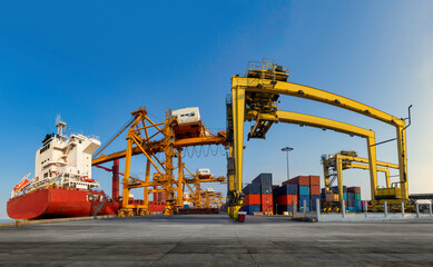 Fototapeta na wymiar Panorama image of container cargo ship with ports crane bridge in harbor. logistics and transportation concept