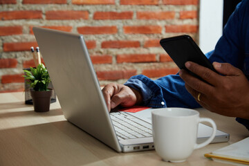 man using mobile smartphone and credit card making online payment