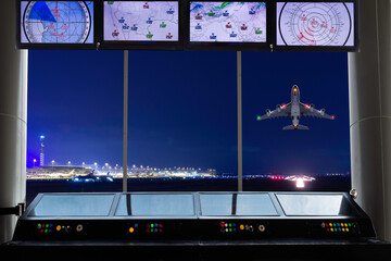 Air traffic control tower with simulation screen showing various flights for transportation and...
