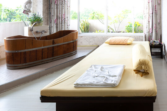 Interior of massage room and spa treatment consisting of vintage wood bathtub