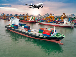 Aerial view of ship cargo containers entering to harbor and airplane flying in the sky against...