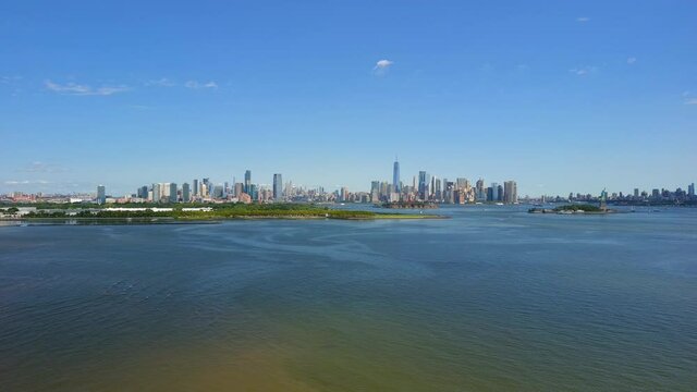 Distant Aerial Slider Shot of the Manhattan, Brooklyn and Statue of Liberty Skyline