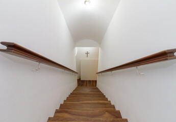 stairs of a house with a cross on the wall in Rio de Janeiro.