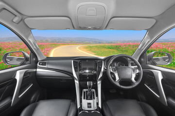 Interior of dashboard in modern car on the road to beautiful nature
